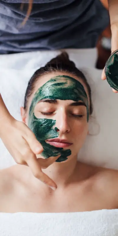 A photo of facial clay being applied.